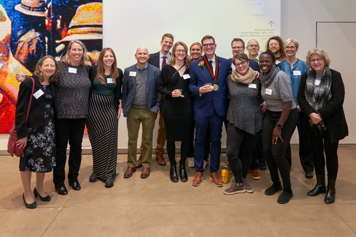 Group of people standing with each other.