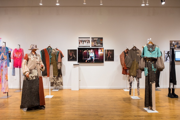 Collection of six garments. Garments are patchworked from fabrics in brown, beige, teal, and rust red.