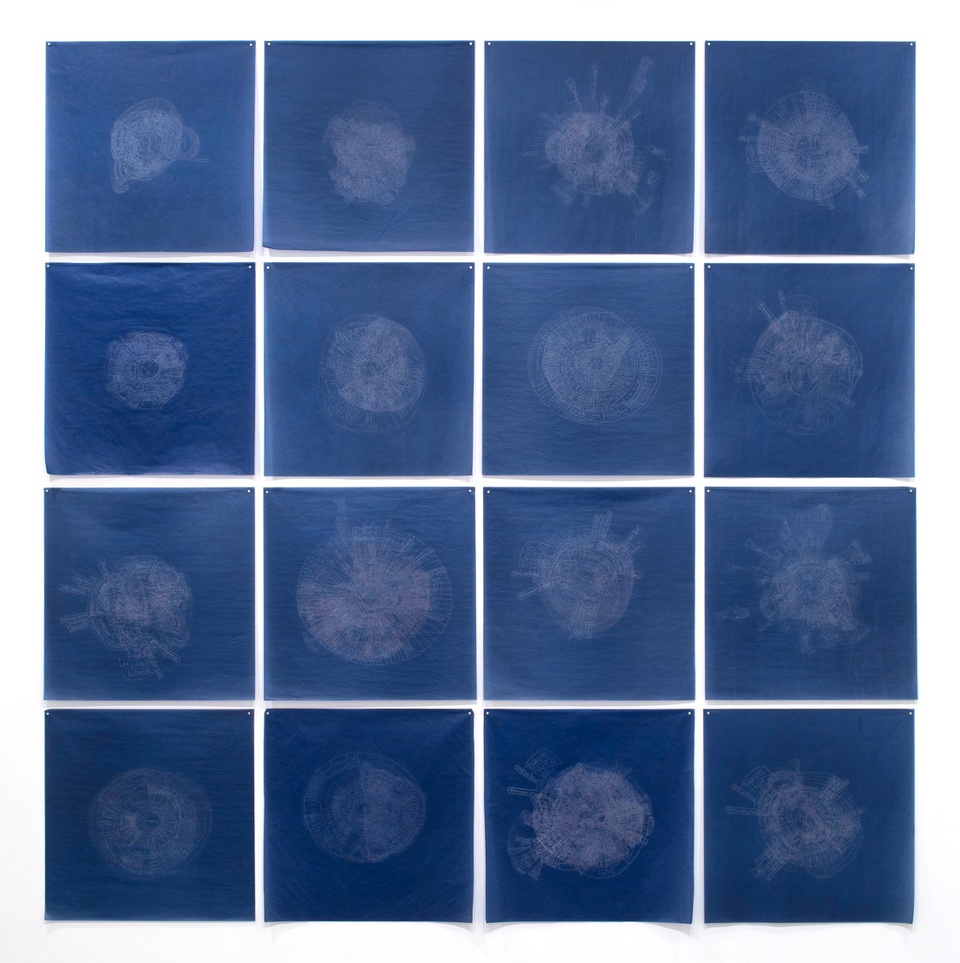 Grid of 16 dark blue carbon squares placed in a grid with light gray light blue circular shapes in the middle of each square
