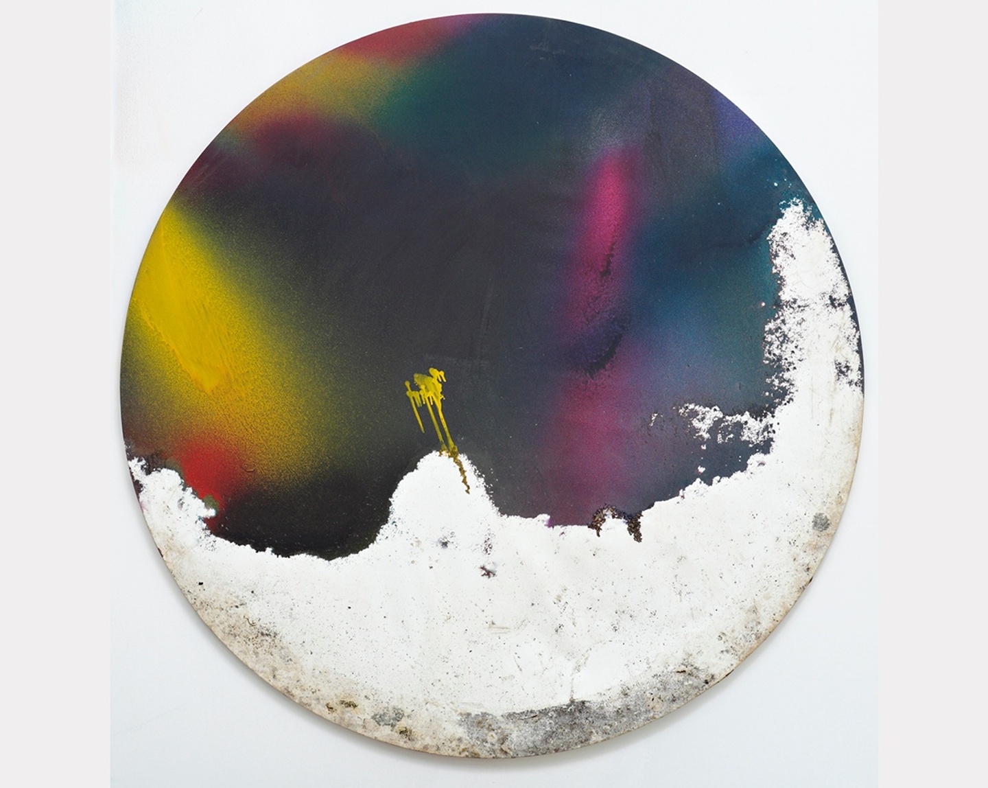 A circular, abstract painting with mostly dark blues, greens, and purples, with splashes of yellow and a section of chalky white at the bottom