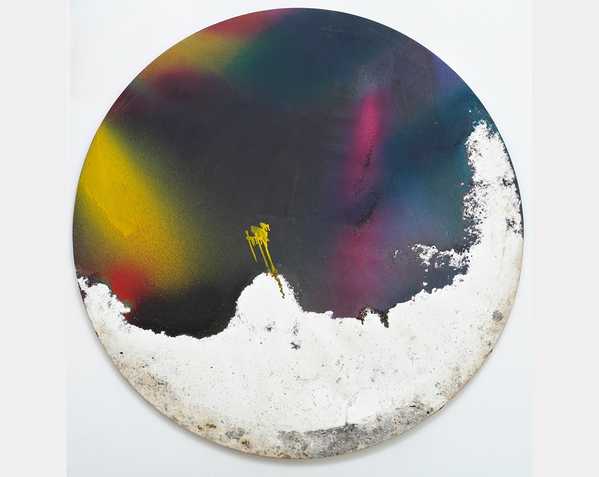 A circular, abstract painting with mostly dark blues, greens, and purples, with splashes of yellow and a section of chalky white at the bottom