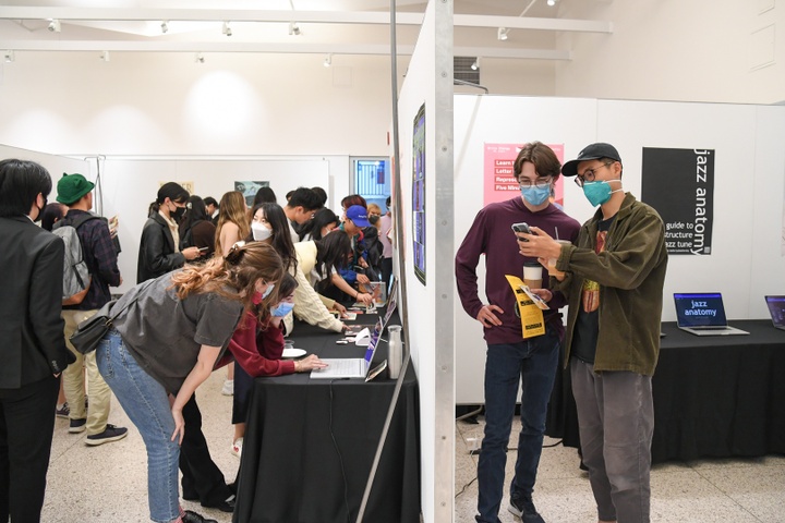 Exhibition view of multiple booths in an exhibition space