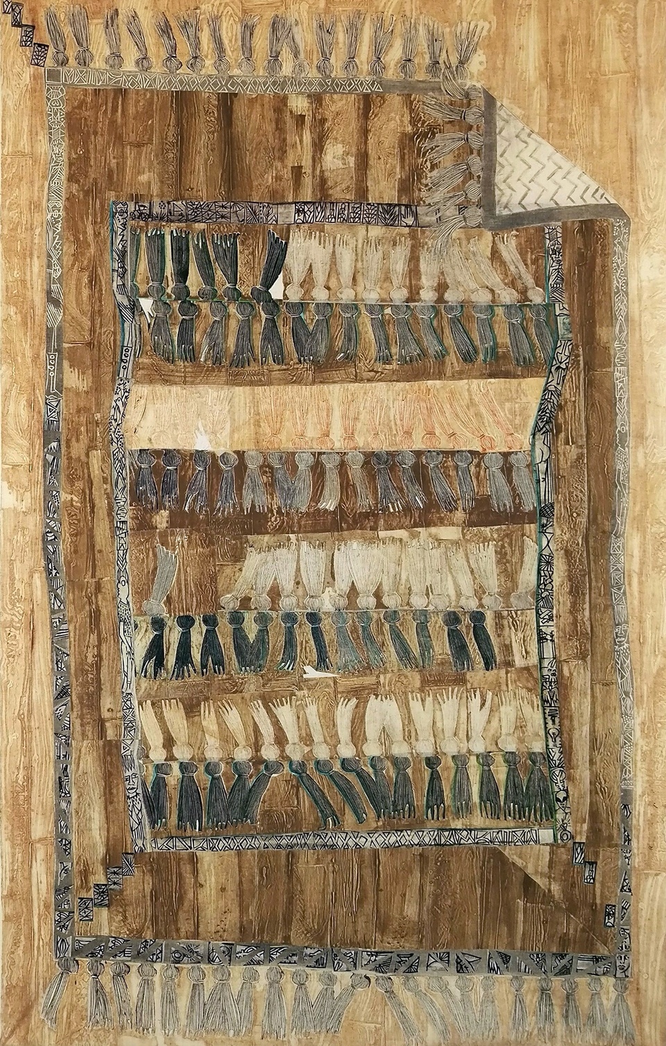 Image of a striped brown and tan rug with black tassels 