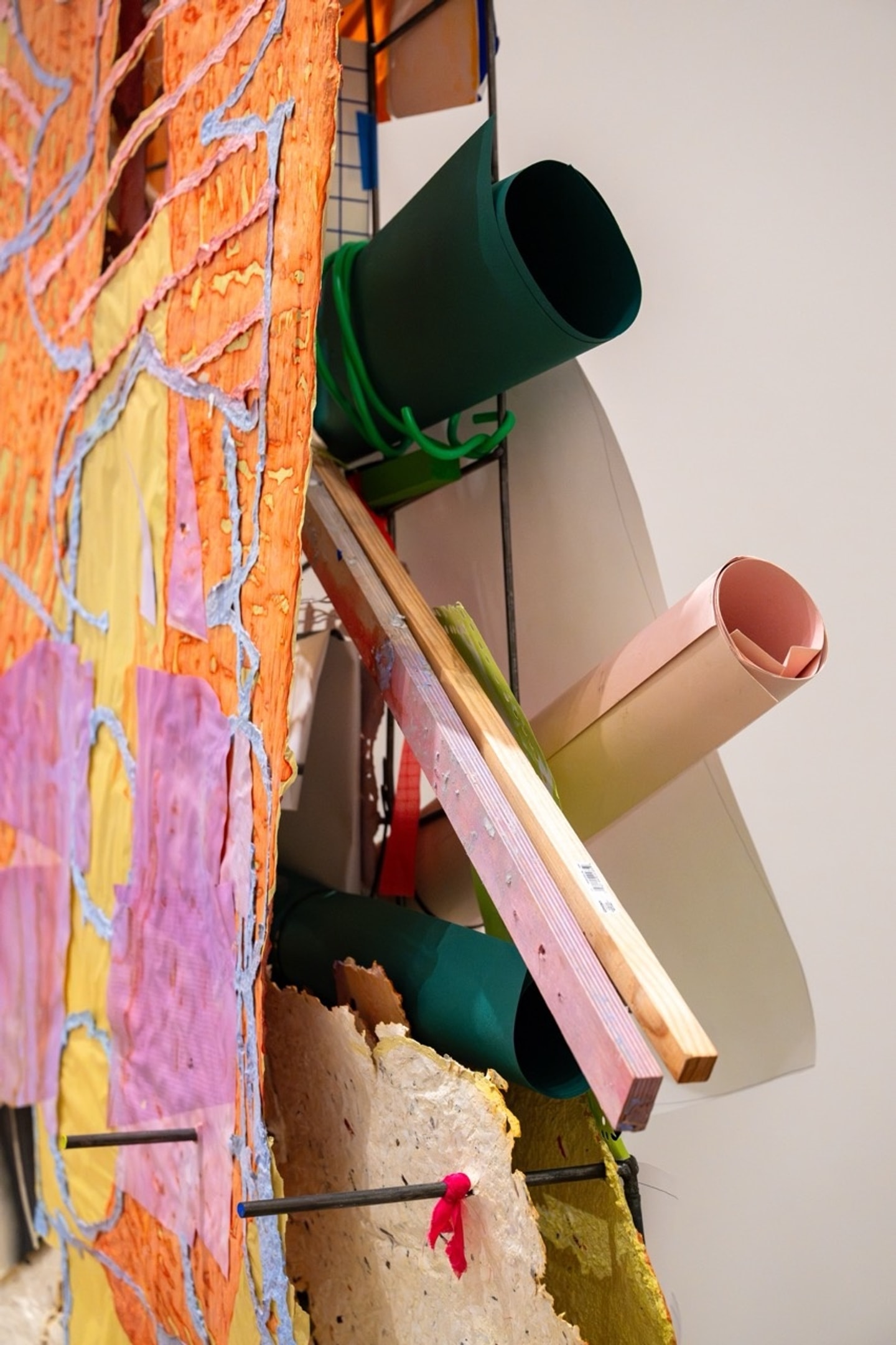 detail of sculptural collage of mixed media such as papers and wires in many colors 