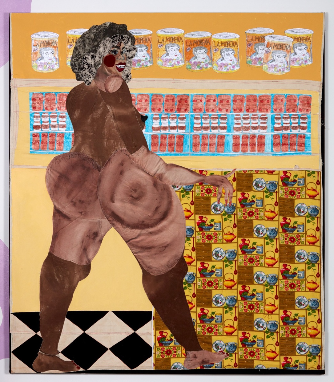 A large, voluptuous, nude, Black woman stands in a colorful room with a row of cans along the top, a row of jars along the middle, and a patterned square along the lower right side. 