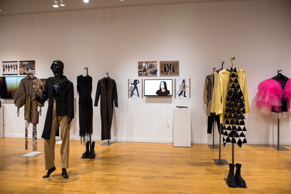 Collection of six garments in black, beige, and sunny yellow.