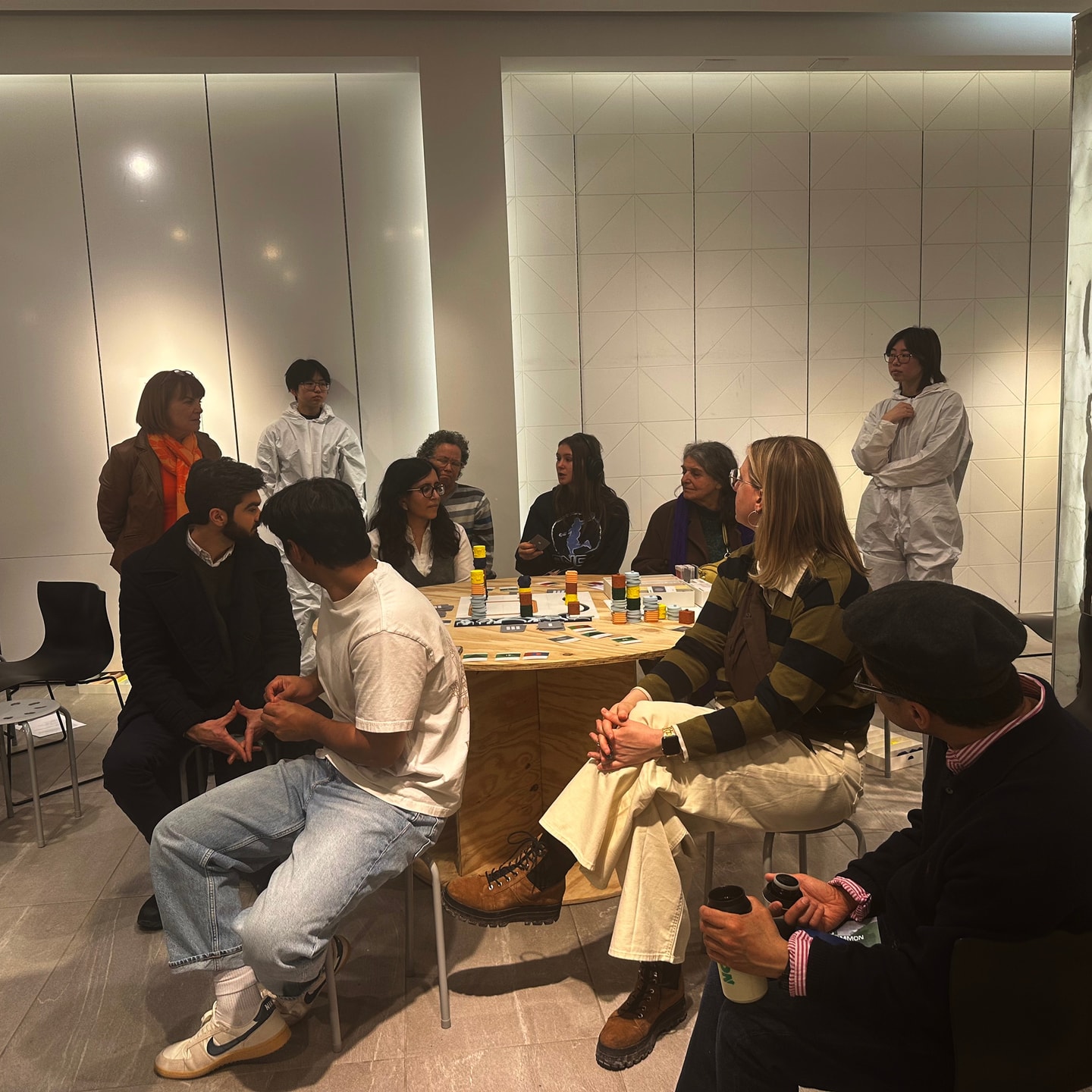 people playing a game around a table
