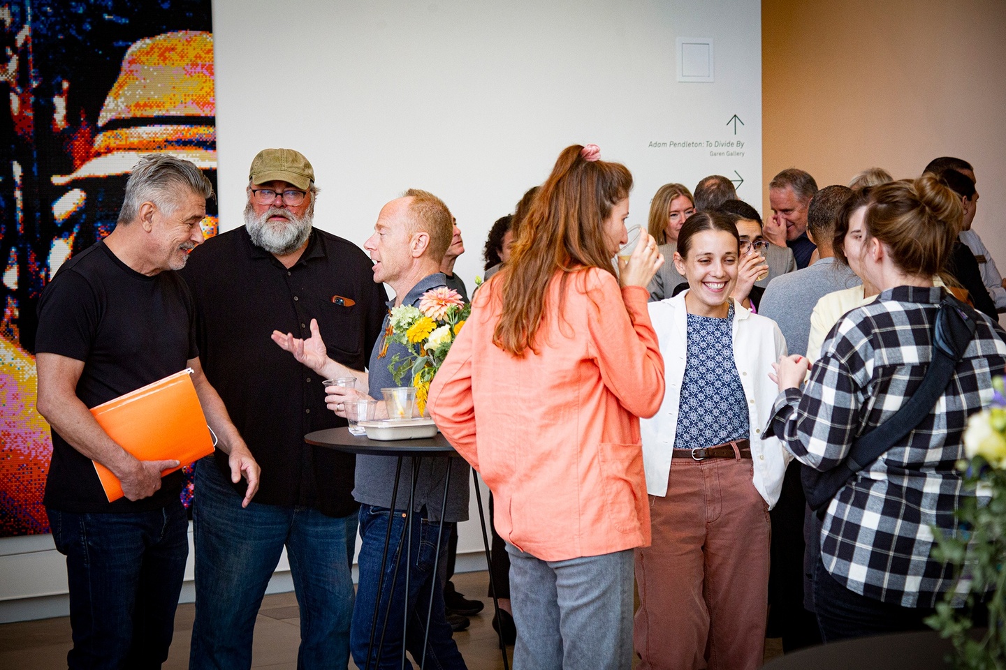 Small groups of people talking and smiling