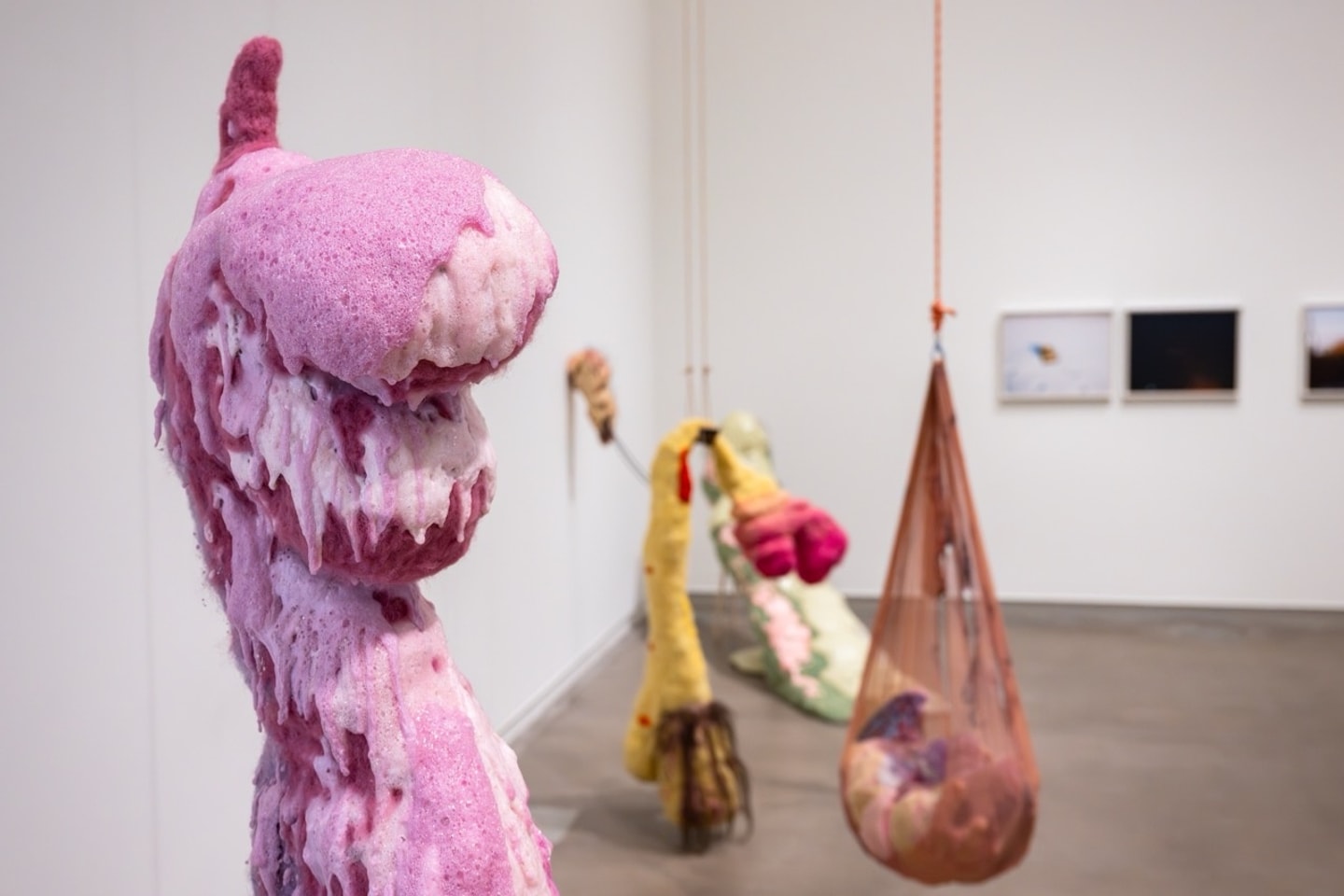 life size felted figures in a variety of colors