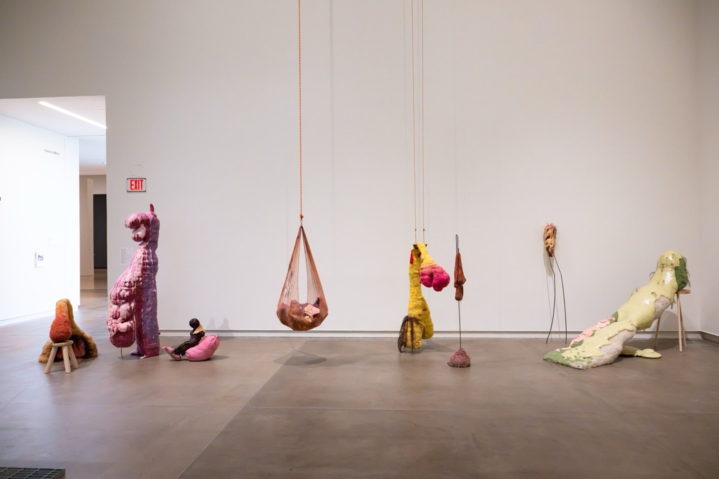 life size felted figures in a variety of colors