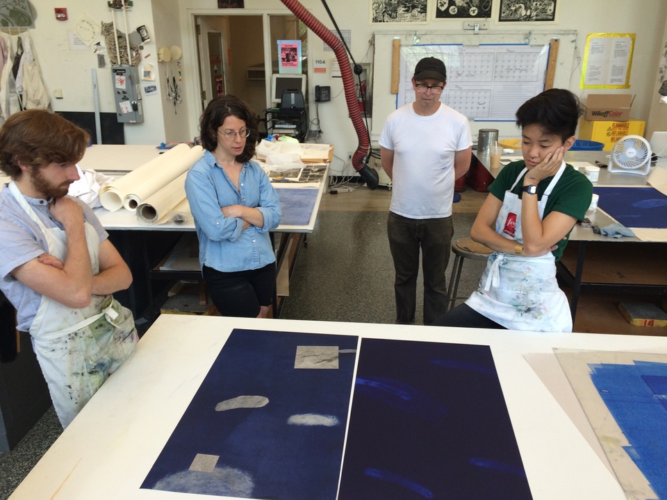Island Press team and artist examine proofs of print
