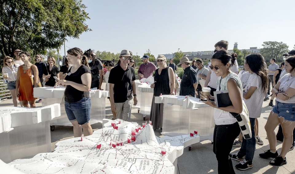 Visitors walk through the outdoor exhibit