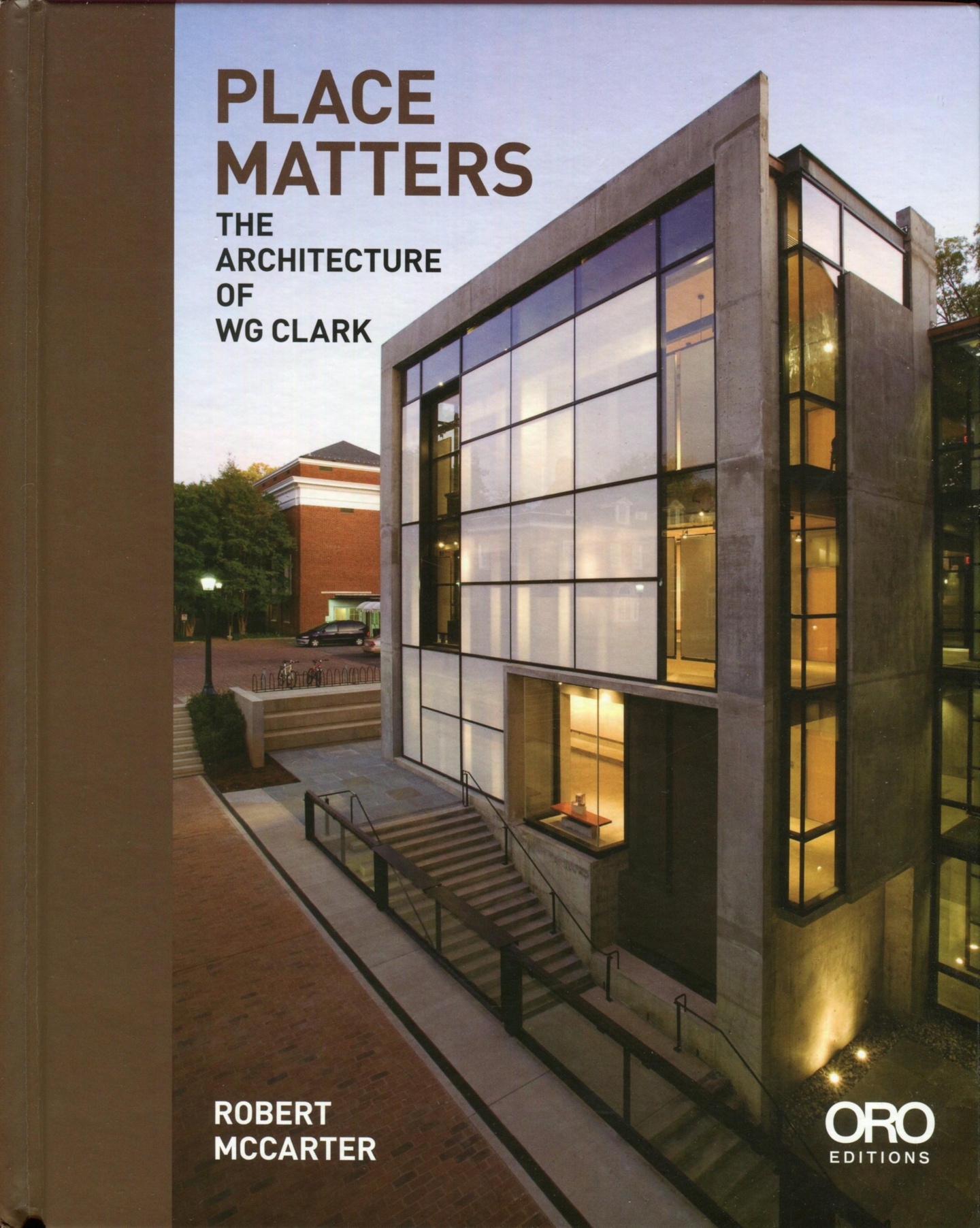 Cover of Place Matters, featuring a contemporary, multistory glass-and-stone building by WG Clark