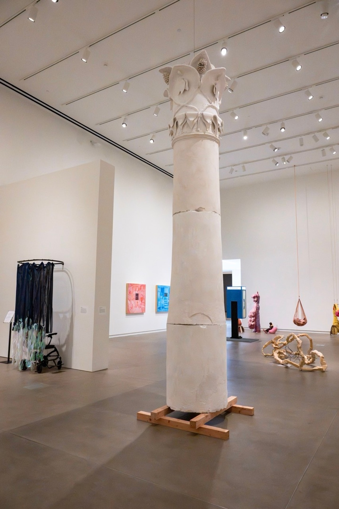 large plaster column with intricately carved details