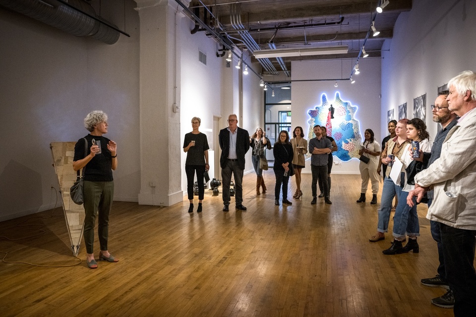 Lisa Bulawsky speaks to students and visitors at the Des Lee Gallery