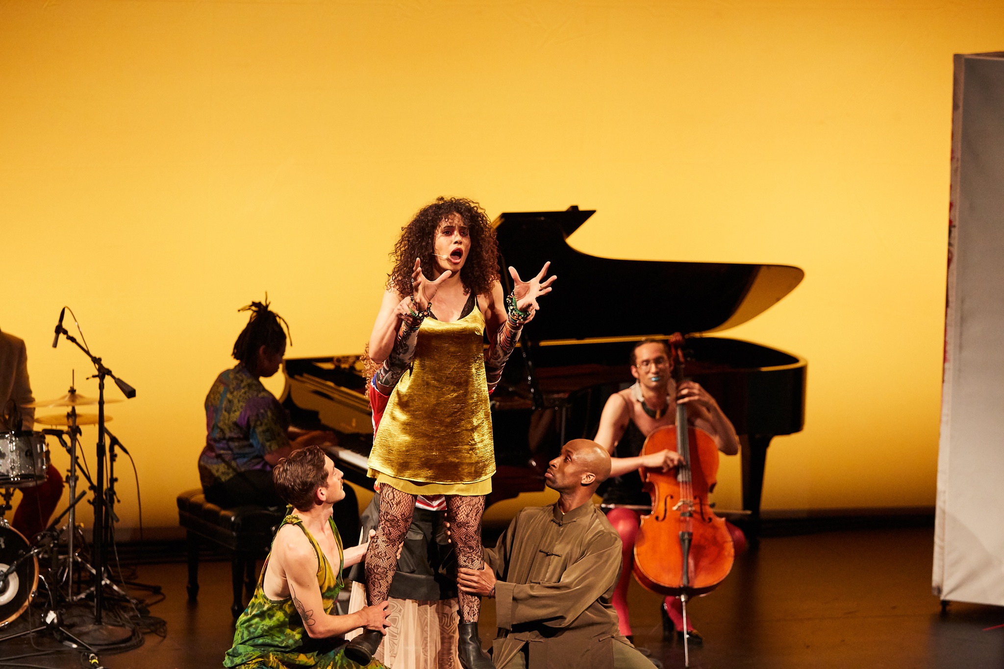 Woman singing on stage with other performers in Richard Kennedy's *HIR*