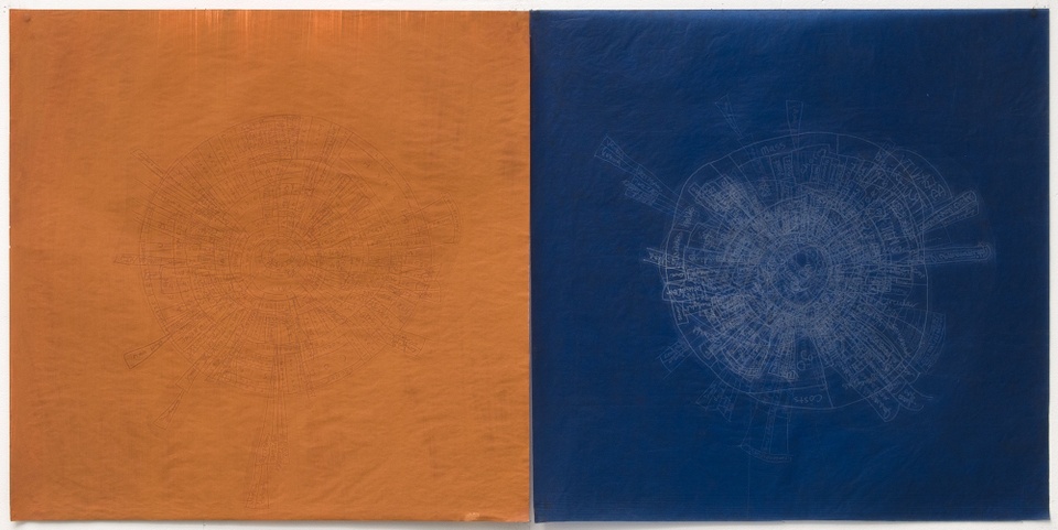Image of a dark iron oxide square printed next to a dark blue carbon square of equal size with circular embossment and debossments on both squares