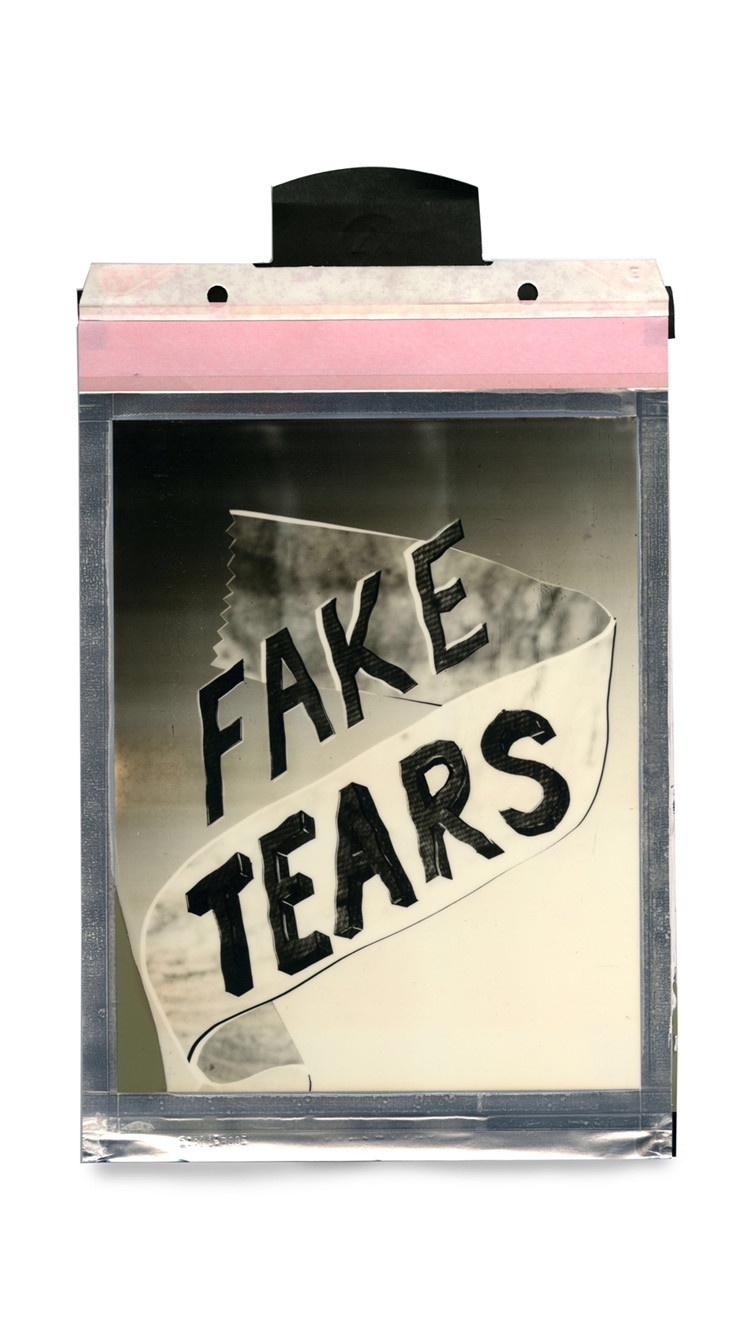 Rectangular artwork with the words Fake Tears in all-caps, made of silver shade instant film Polaroid type.