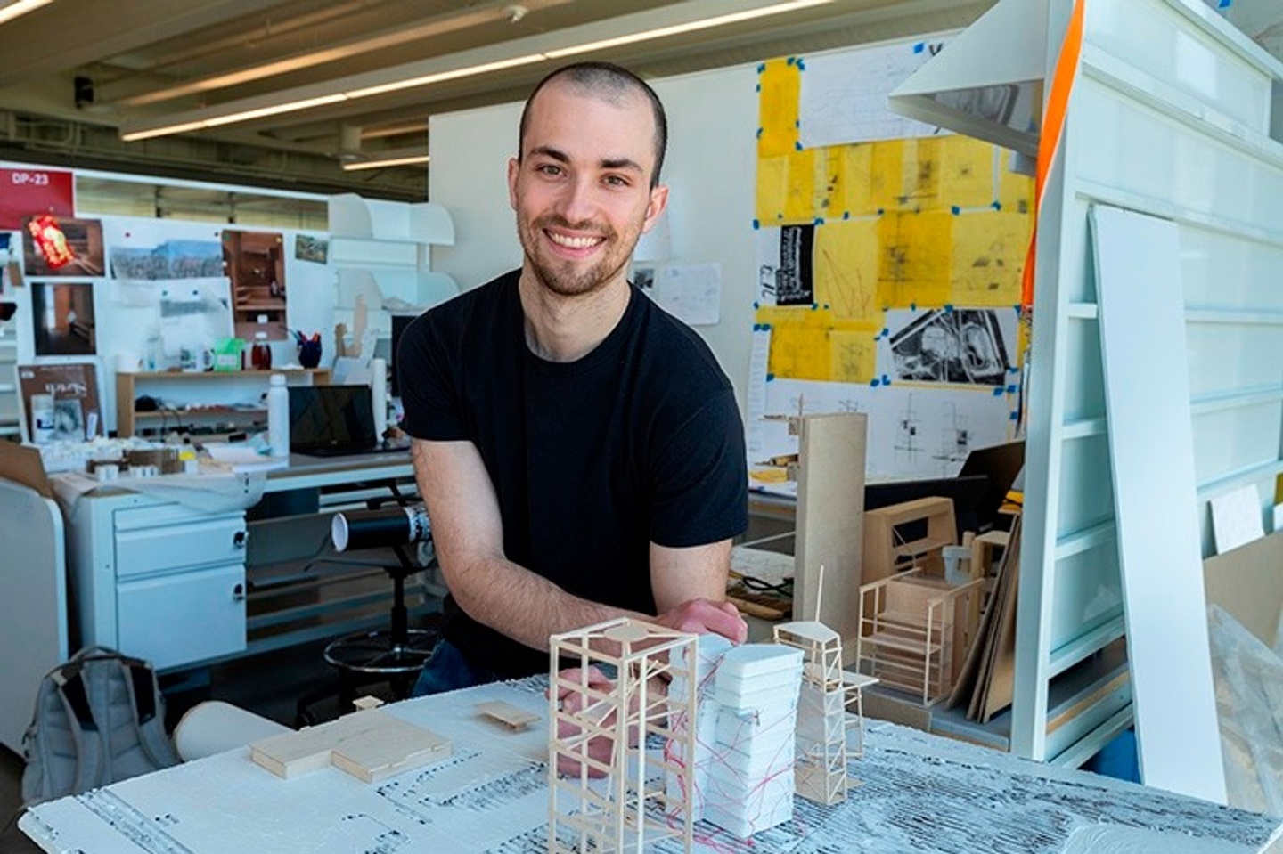 Nathan in his studio leaning against a table