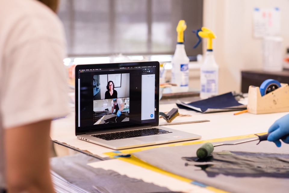 Laptop on table during Zoom workshop with visiting artist Erika Blumenfeld