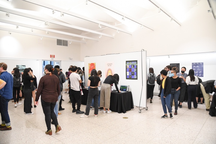 Exhibition view of multiple projects in various table booths