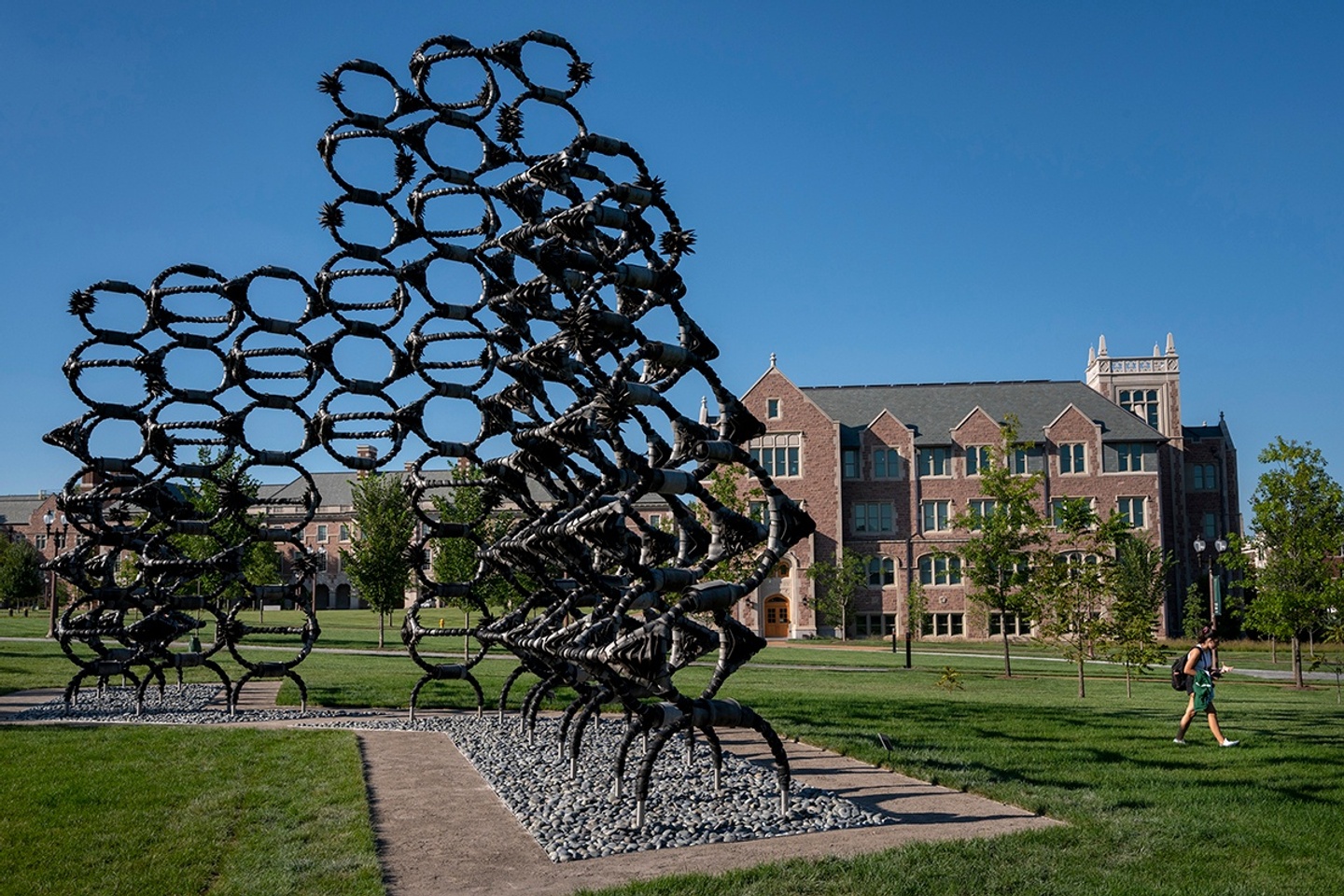 A large sculpture composed of circular modules linked together