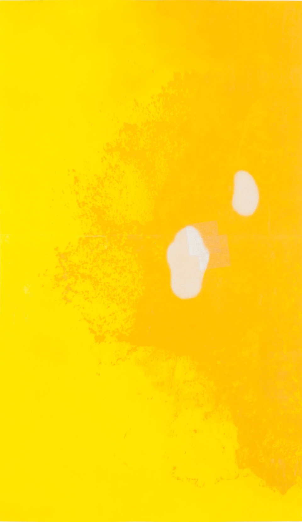 Darker yellow splotches on a yellow background