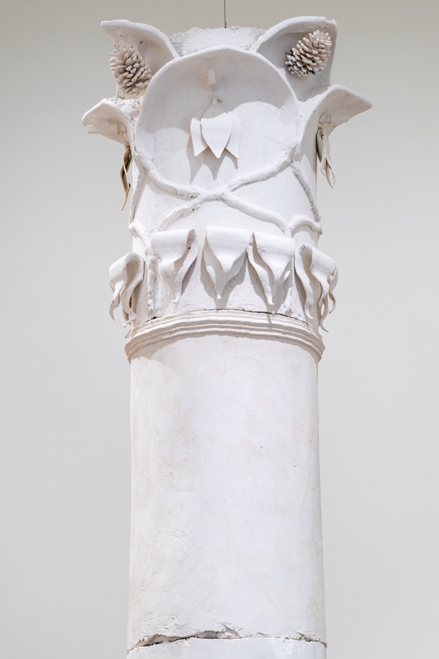 detail of large plaster column with intricately carved details