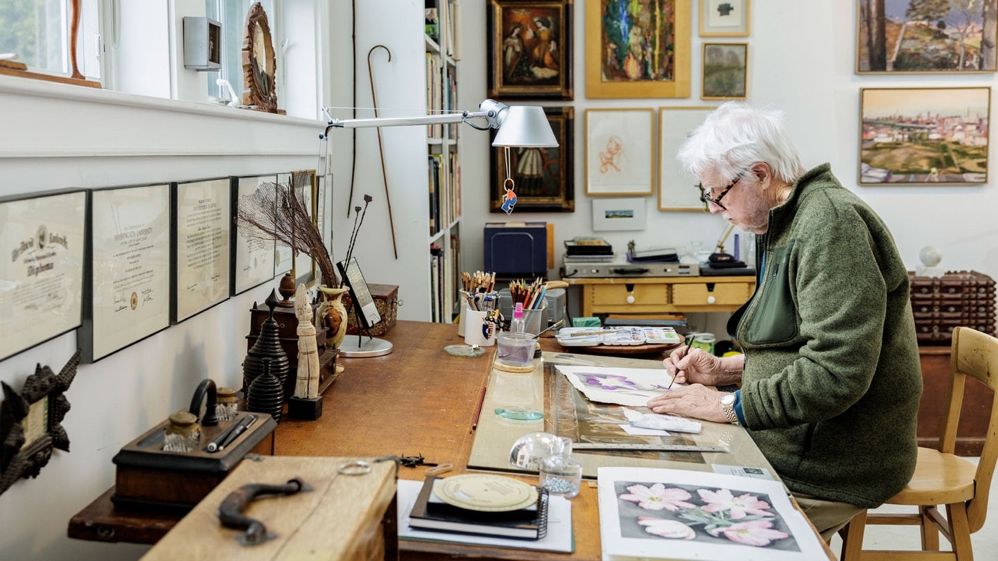 John Moore painting in his studio