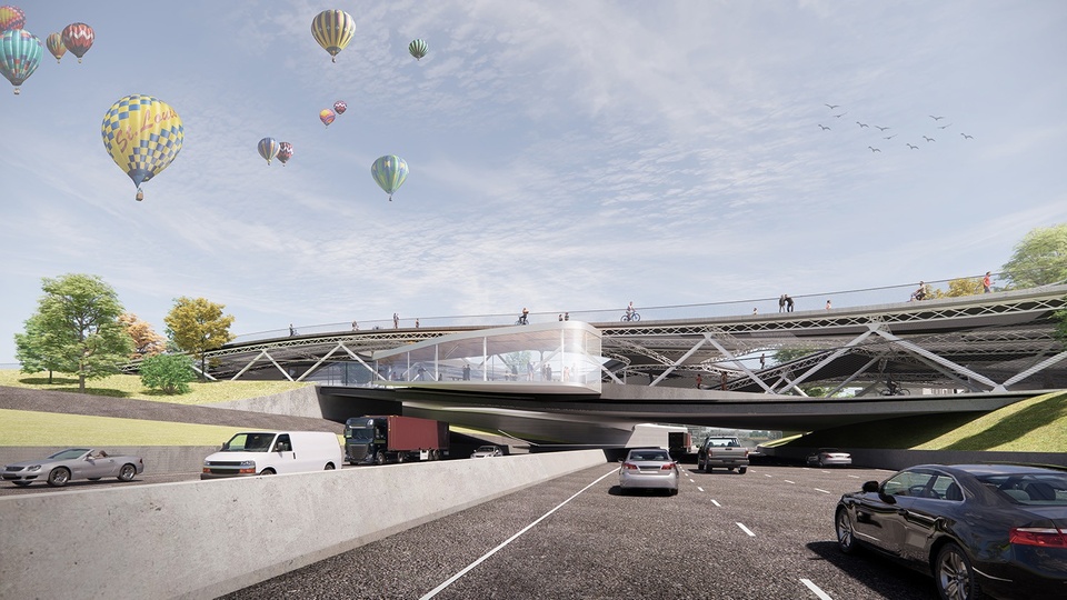 Rendering of the existing highway with a new landform bridge over the top, and several hot air balloons in the sky.
