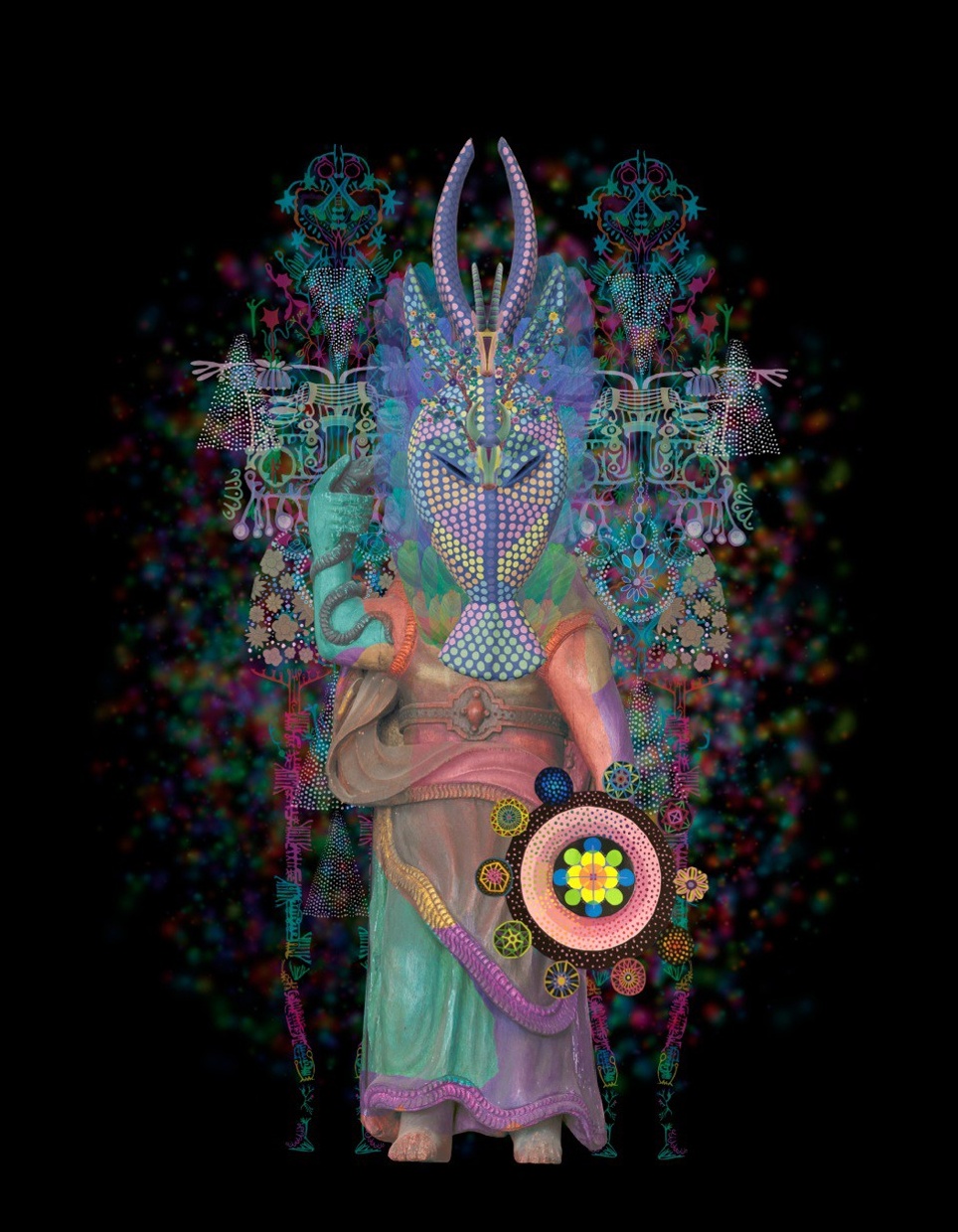 On a black background a sculptural figure stands with a horned mask on. It points upward with index finger of right hand. It’s robed and around it are floral patterns and symbols in bright green, purple, orange, yellow, and pink.
