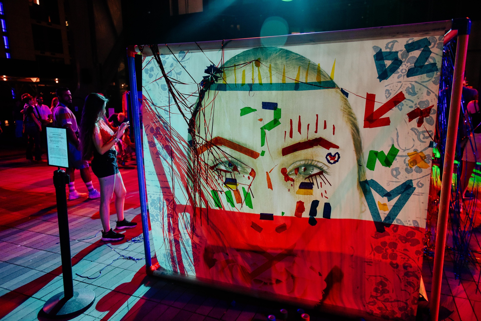 An audience member interacting with an installation artwork by MIPSTERZ.