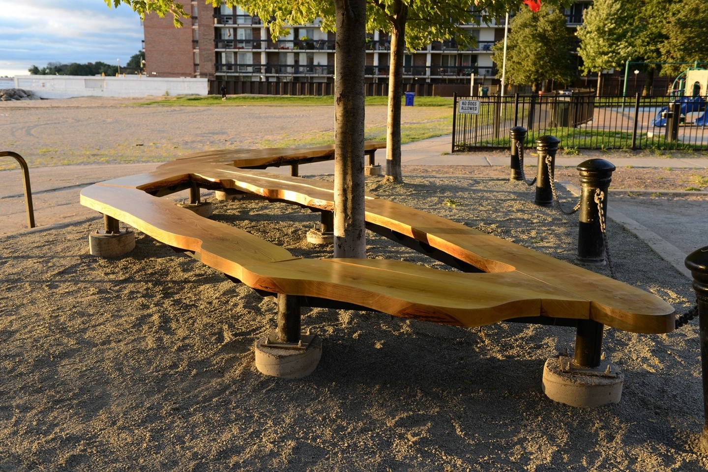 A wooden sculpture as a park bench