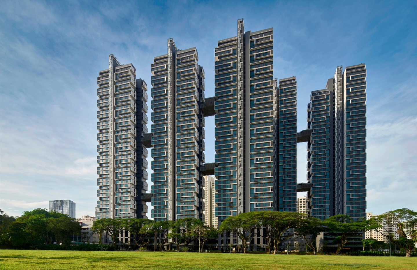 Photo of apartment buildings with 5 towers joined by walkway bridges