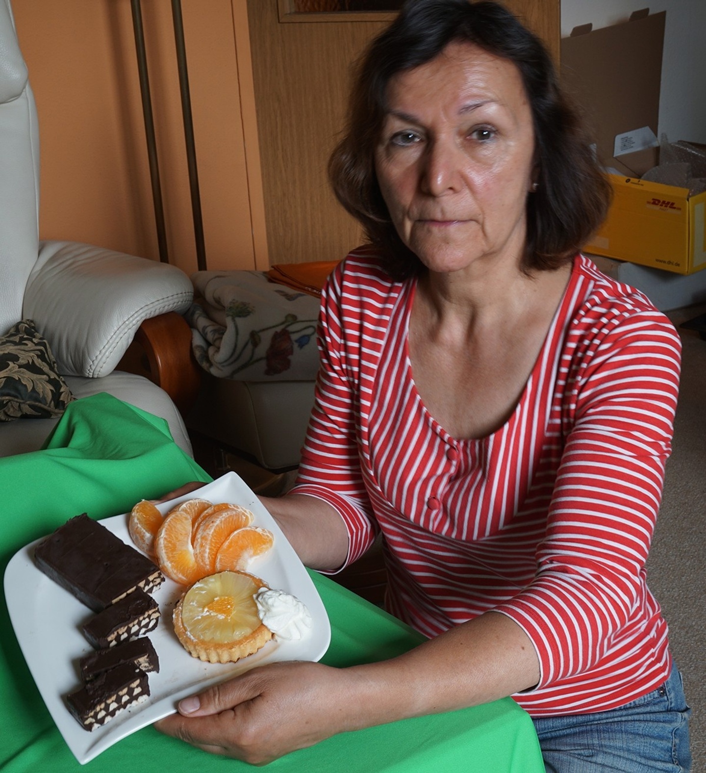 woman in a red shirt sitting with food in front of her for a food exchange