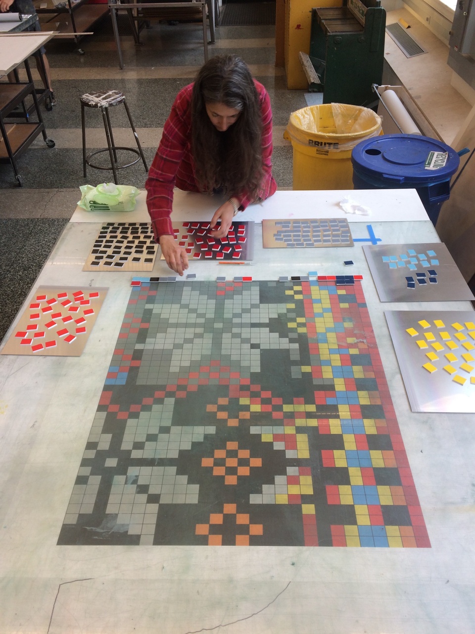 Lisa Anne Auerbach on the press placing tiles for printing Snowflake.