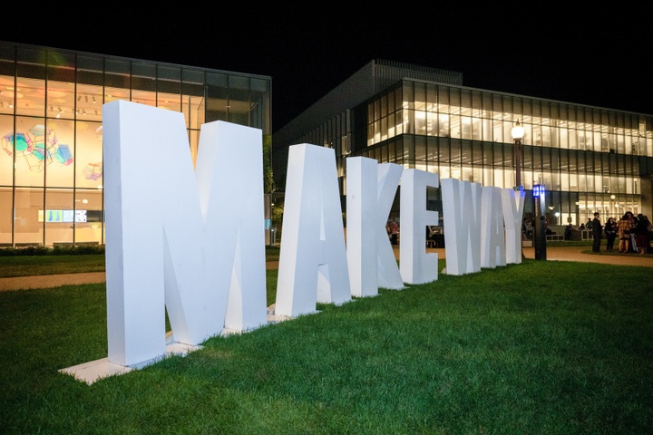 The phrase "Make Way," spelled out in 5-foot tall white block letters, set up on a lawn between the Kemper Art Museum and Weil Hall.