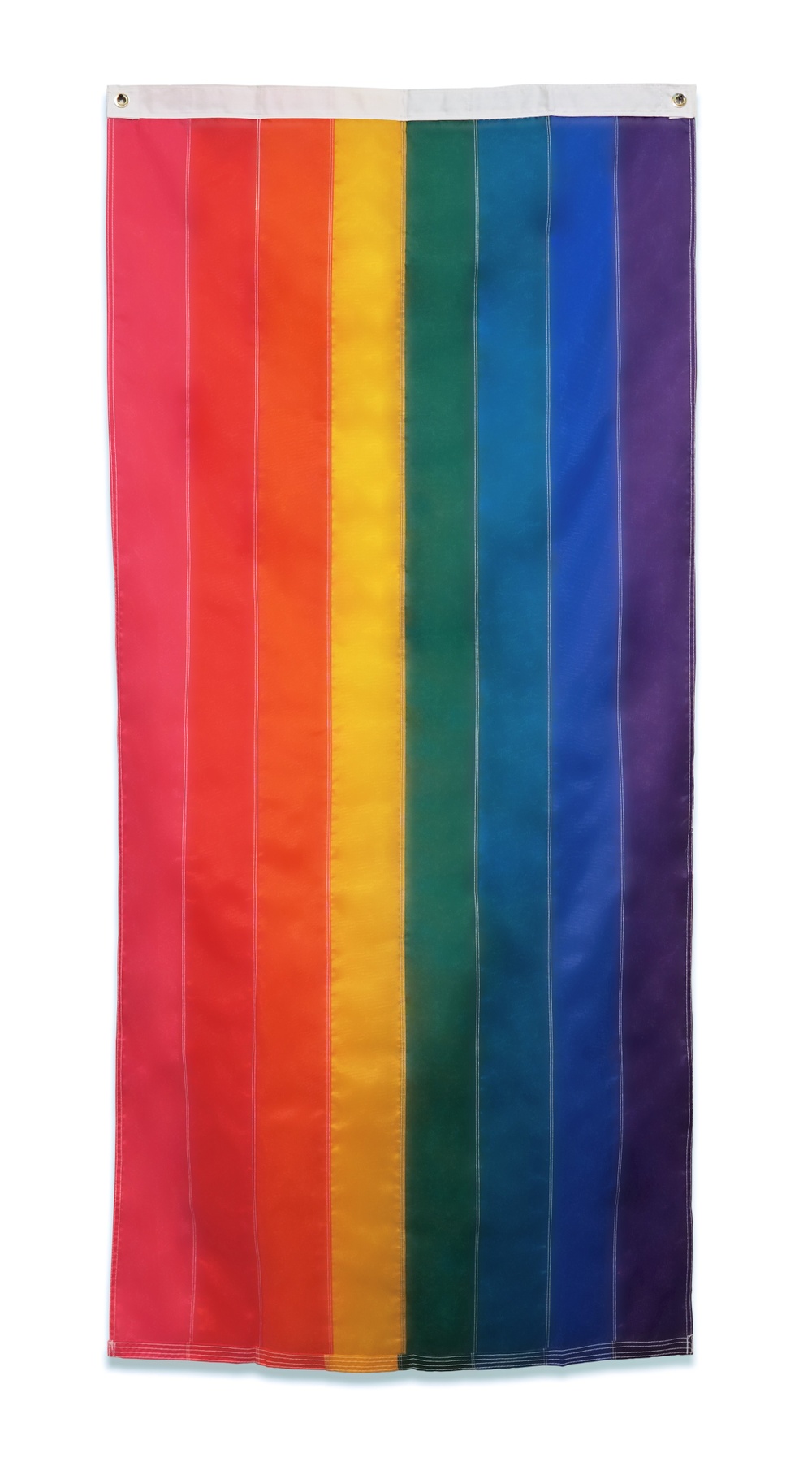 A large flag with eight color stripes that make a rainbow.