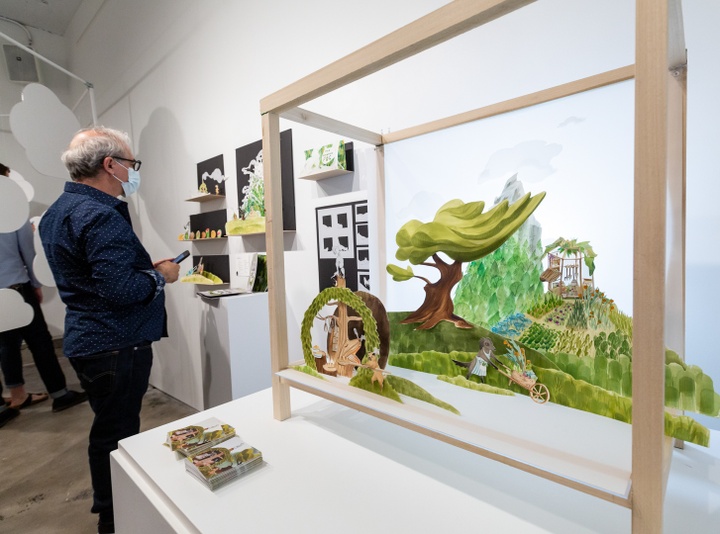 A paper diorama of anthropomorphic animals gardening and making bread