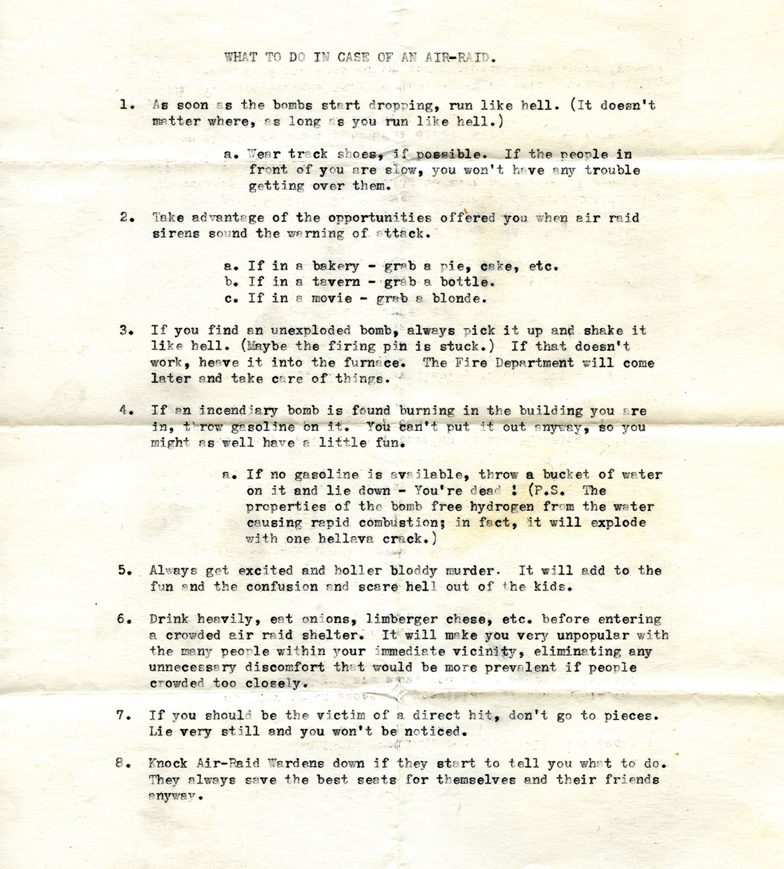 A slightly yellowed and stained document with many creases and crease marks has the headline “WHAT TO DO IN CASE OF AN AIR-RAID” in typewritten font. The text on the page is slightly illegible.