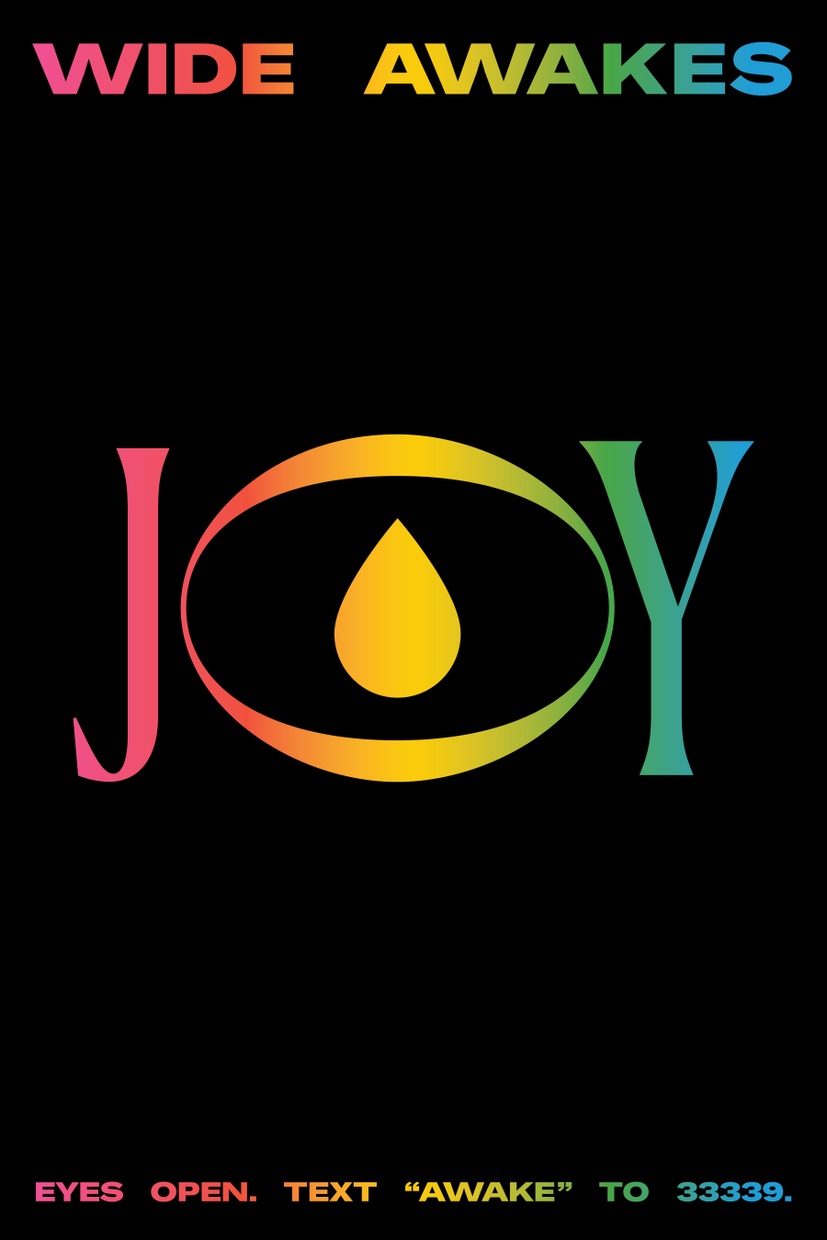 A black poster with “Wide Awakes” across the top and the word “JOY” in large letters in the center. The text is filled with a rainbow gradient.