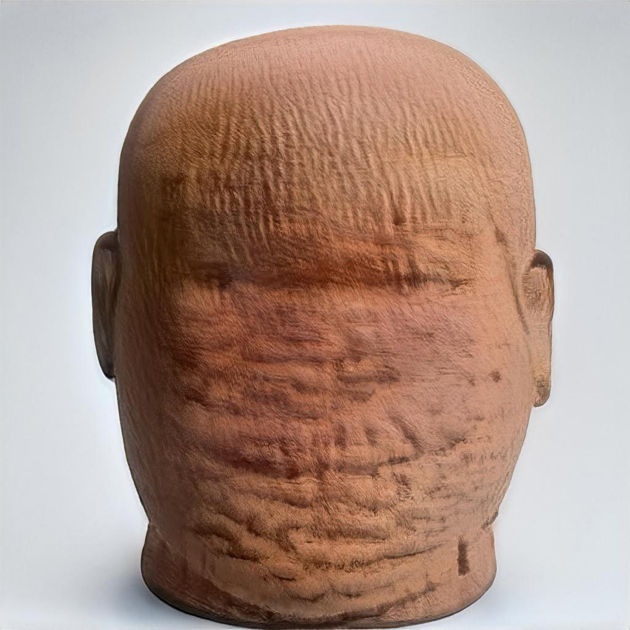An AI-generated close up view of a weathered terracotta sculpture showing the faint remnants of a brown and ears but no other features.