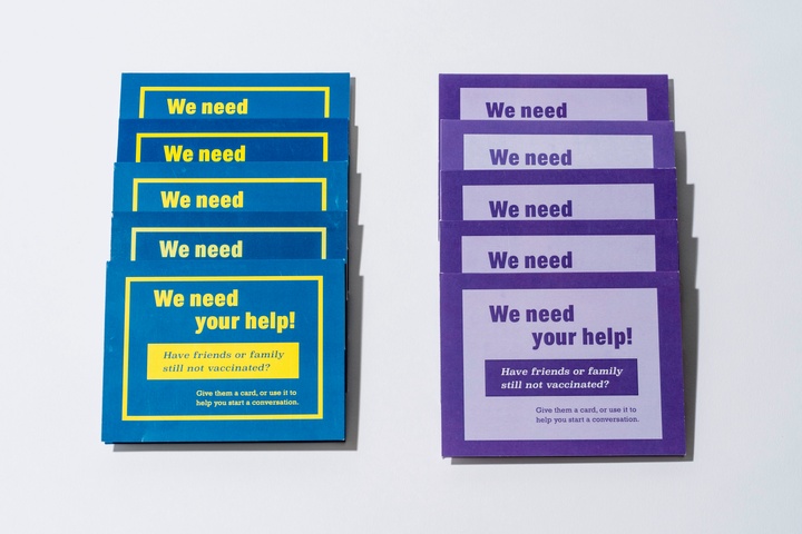Two lines of five card holders, the left side blue and the right purple, each saying, "We need your help! Have friends or family that are still not vaccinated? Give them a card or use it to start a conversation."