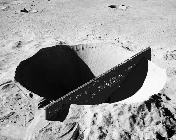 a black and white image of a crater
