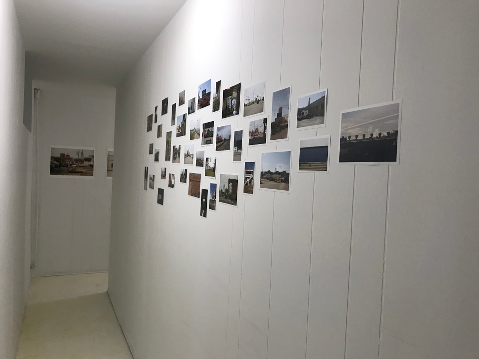 Photo of a gallery installation of photographs. 