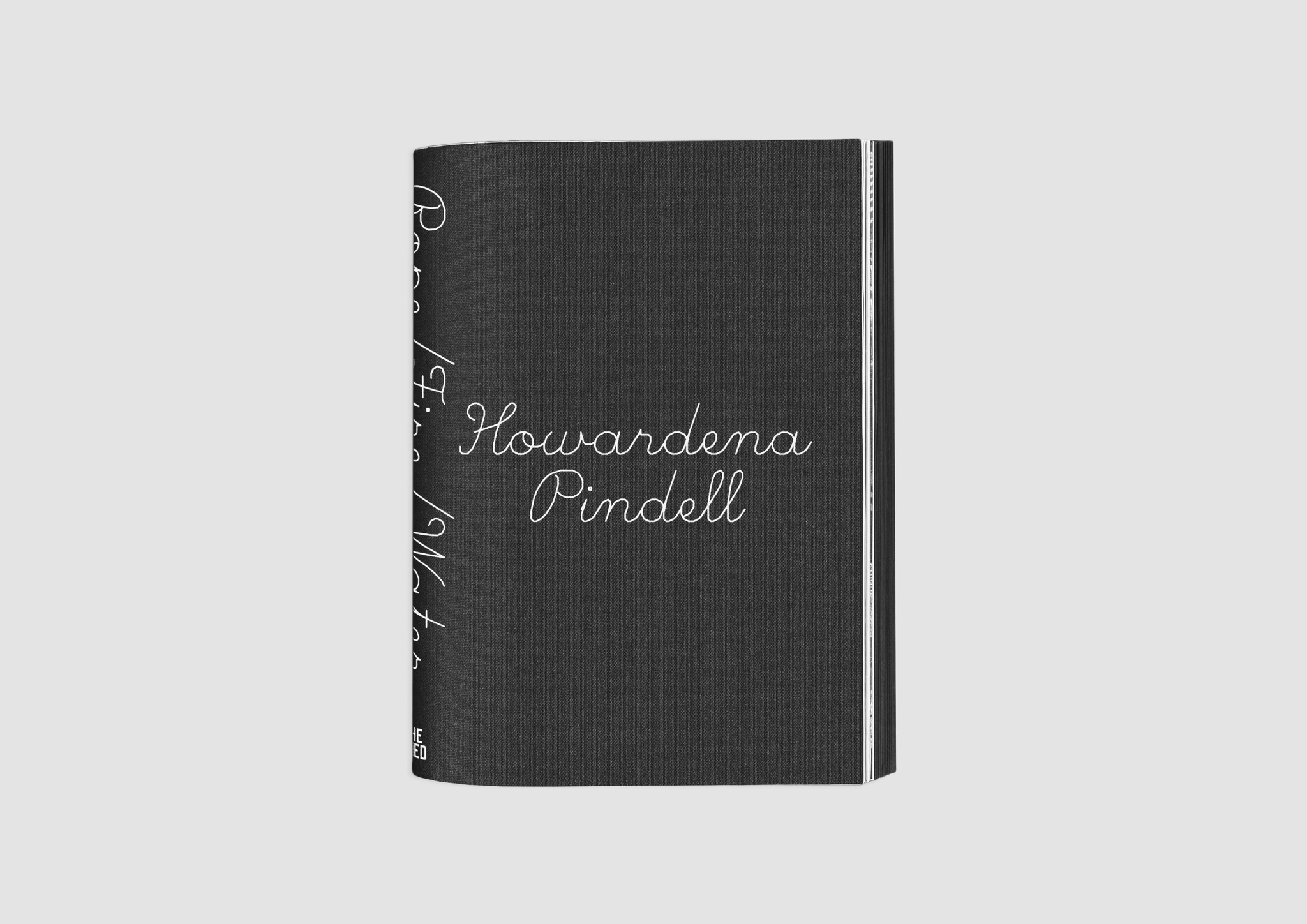 The front cover of the catalogue for "Howardena Pindell: Rope/Fire/Water." The cover is black with the name Howardena Pindell centered in white script, the subtitle of the book is half-visible in script along the book's spine
