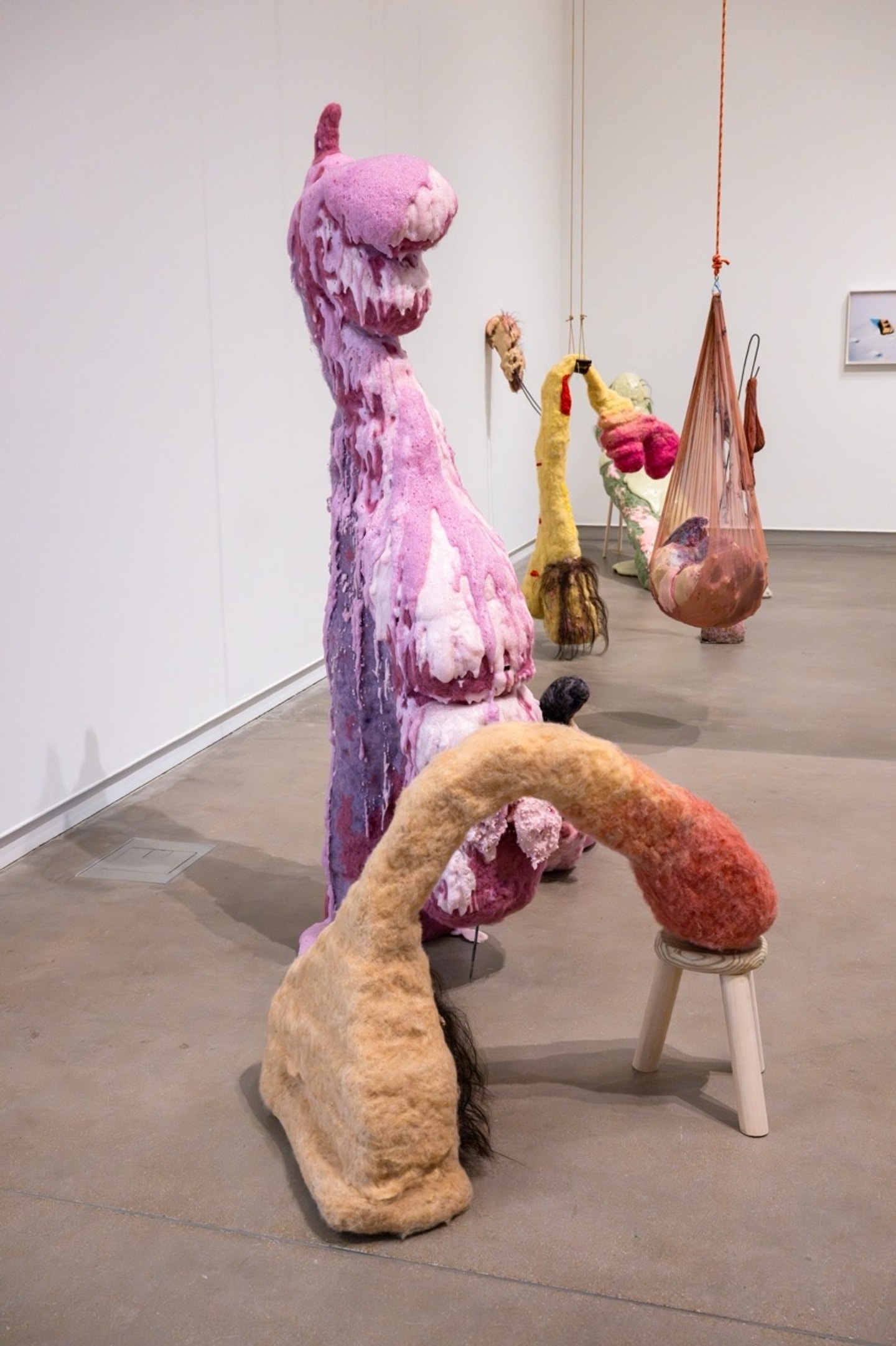life size felted figures in a variety of colors