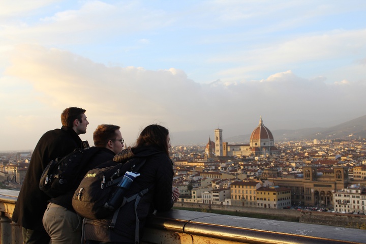 Three students overlooking Florence, Italy at sunset.