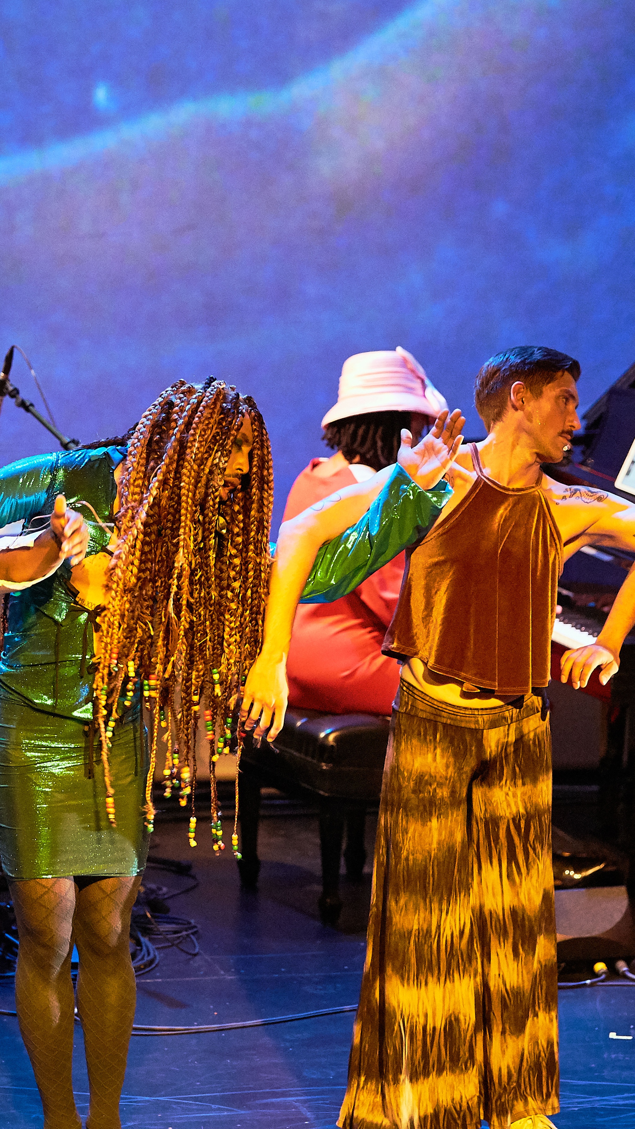 Two dancers performing on a stage.