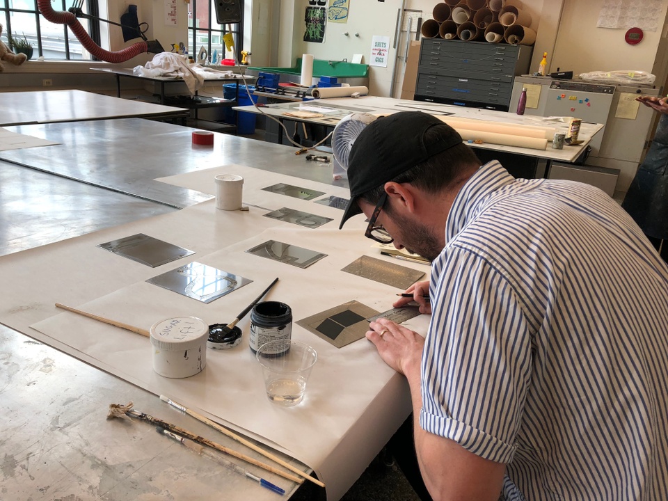 Artist working in the print shop